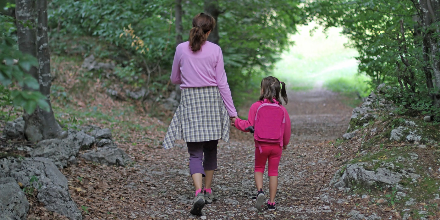 mother and child walking outdoors