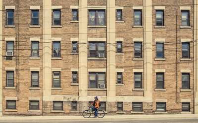 cyclist in front of building